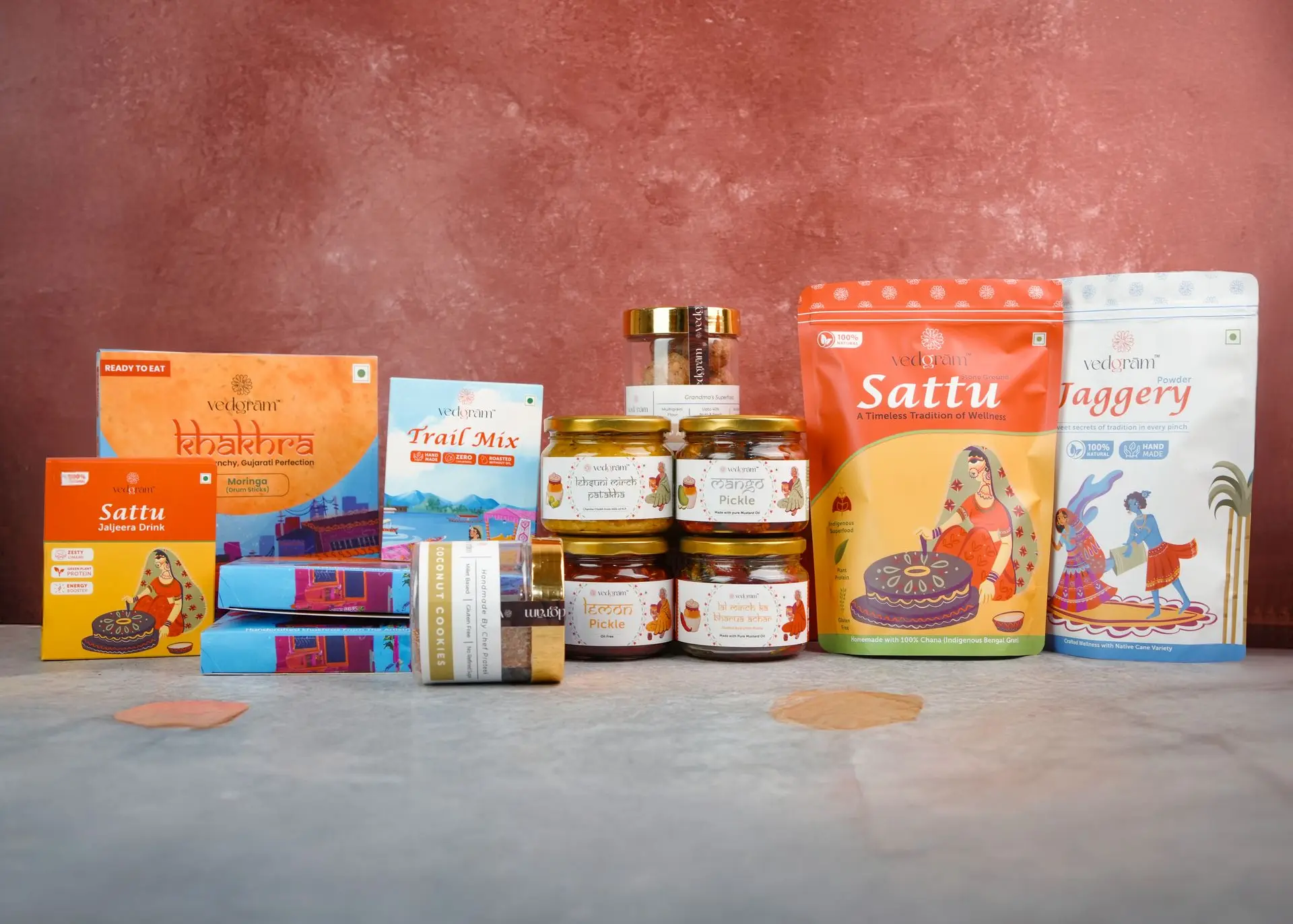 Vedgram product range including Healthy snacks, Stuffed Red Chilli Pickle, Coconut Millet Cookies, Chocochip Cookies, and Green Chilli Garlic Chutney – organic and preservative-free superfoods